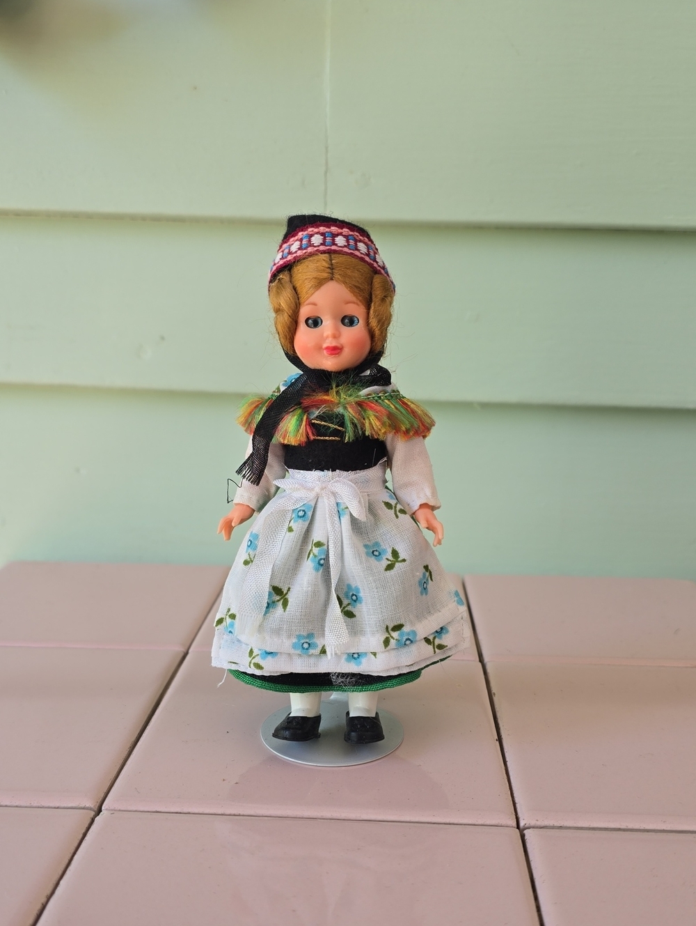 Vintage plastic doll in traditional European folk costume